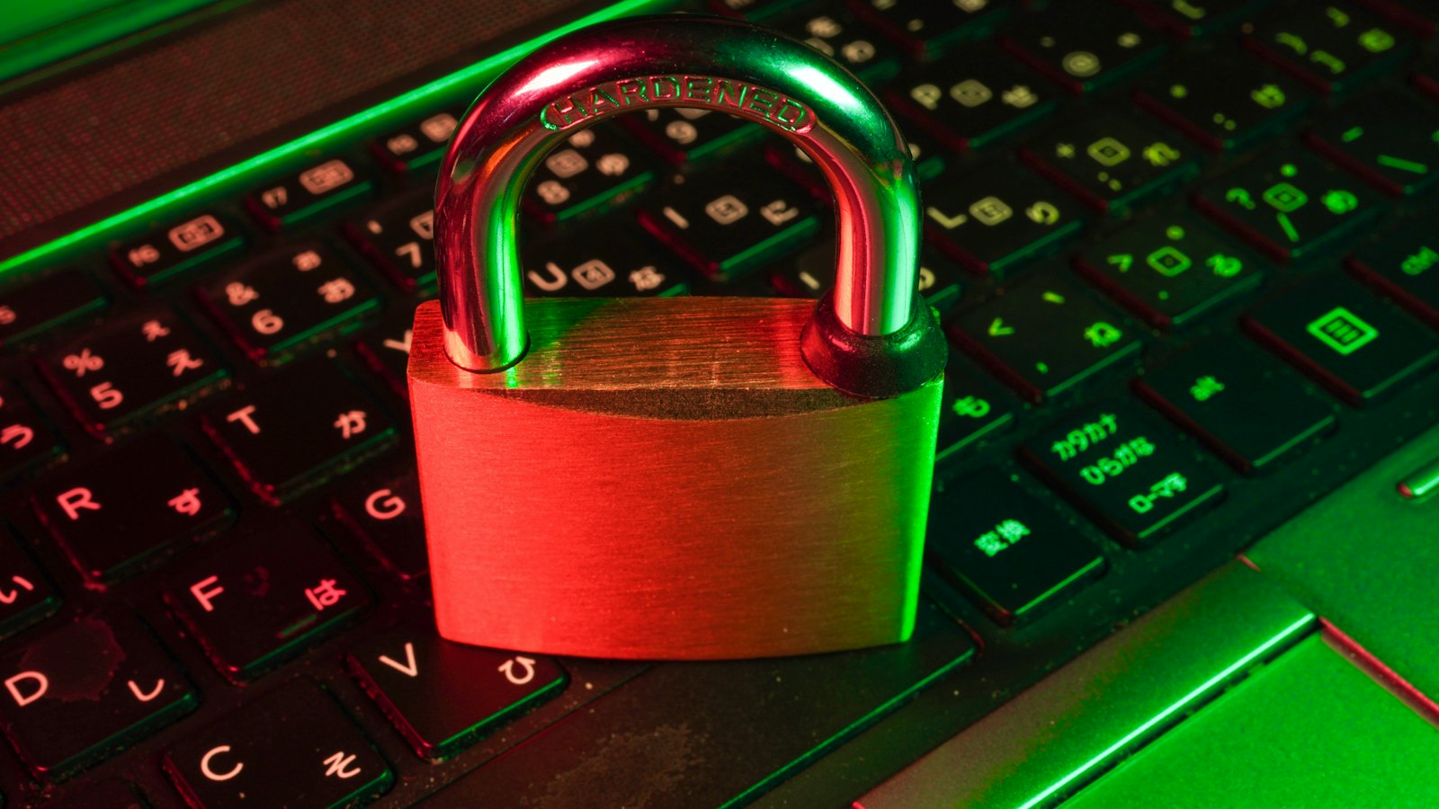 A padlock resting on top of a backlit keyboard