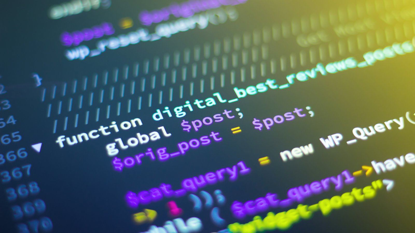 A close-up of colorful syntax-highlighted code on a laptop screen
